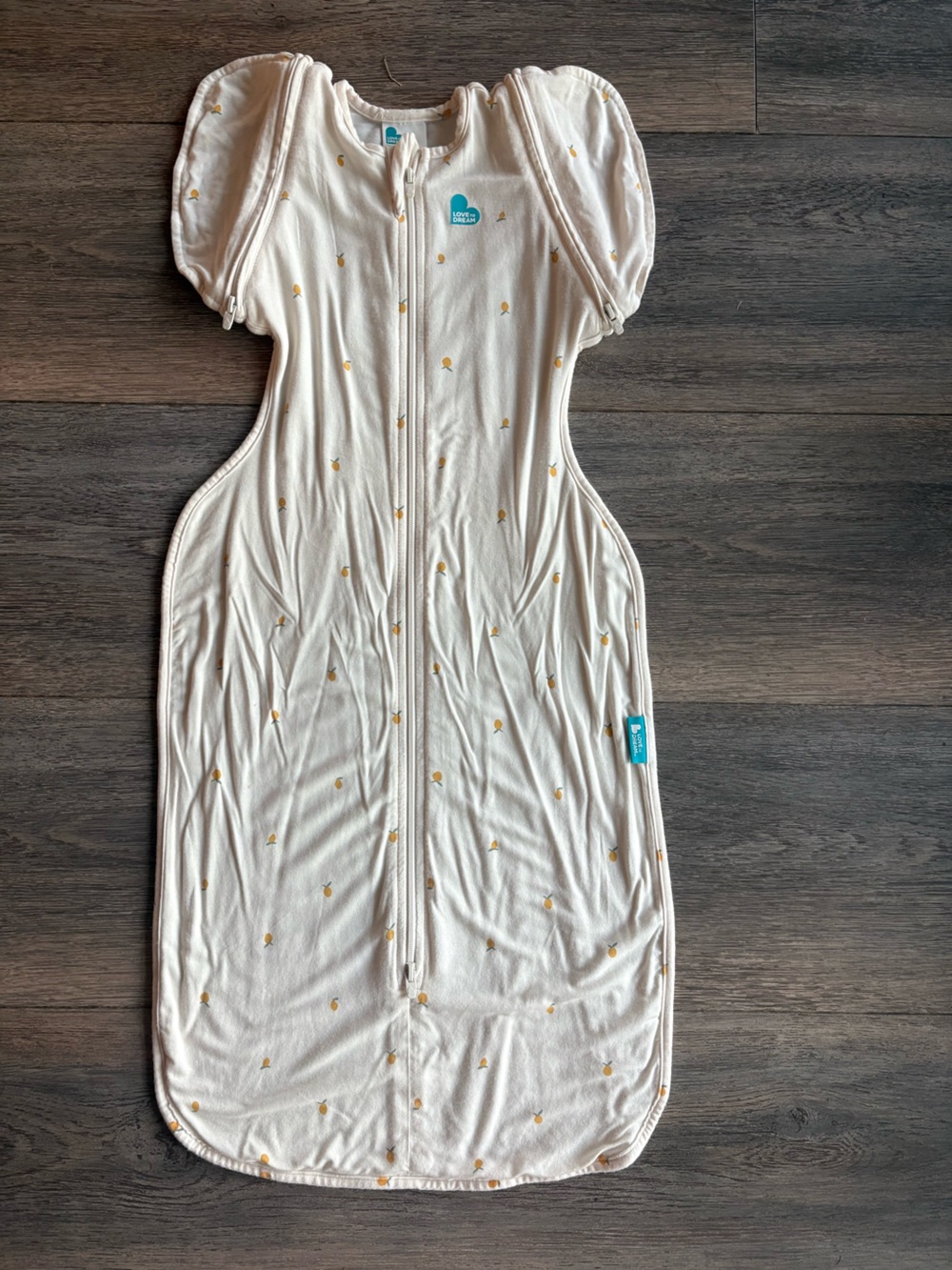 Love To Dream Transition Cream lemon Swaddle One-Piece with Gold Dot Print